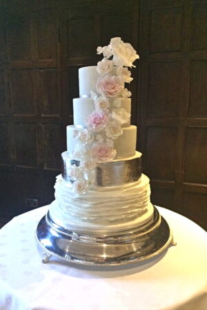 5 Tier sugar rose, ruffle and silver leaf cake at Great Fosters